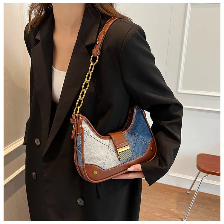 Brown denim women's shoulder bag with diamond mesh and chain detail, bucket shape.