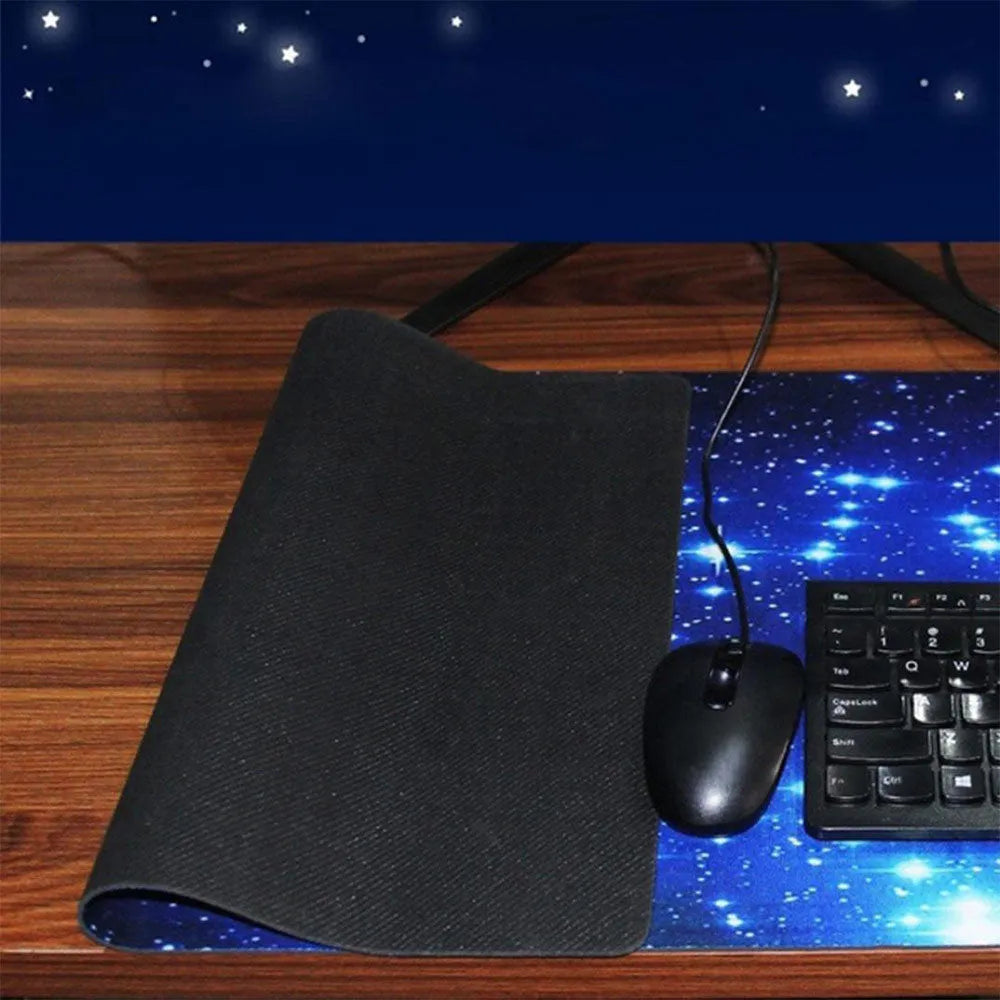 Blue star mouse pad with high-density fabric surface and anti-skid natural rubber base on a desk