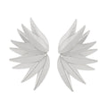 Gold and white alloy leaf-shaped patch earrings on a plain background