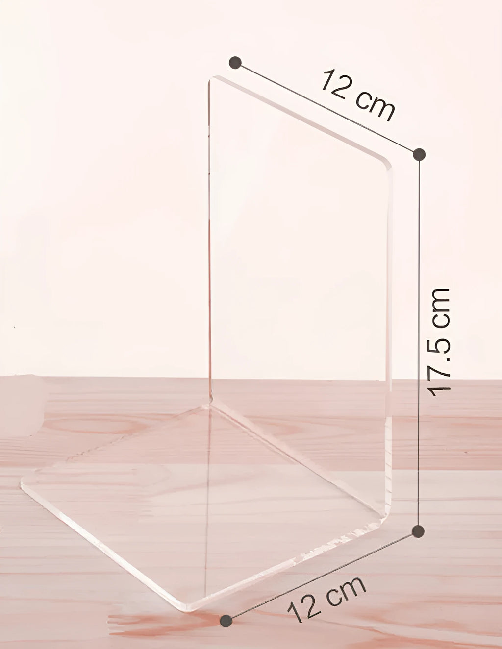 Clear transparent acrylic bookshelf holding a small stack of books on a desk.
