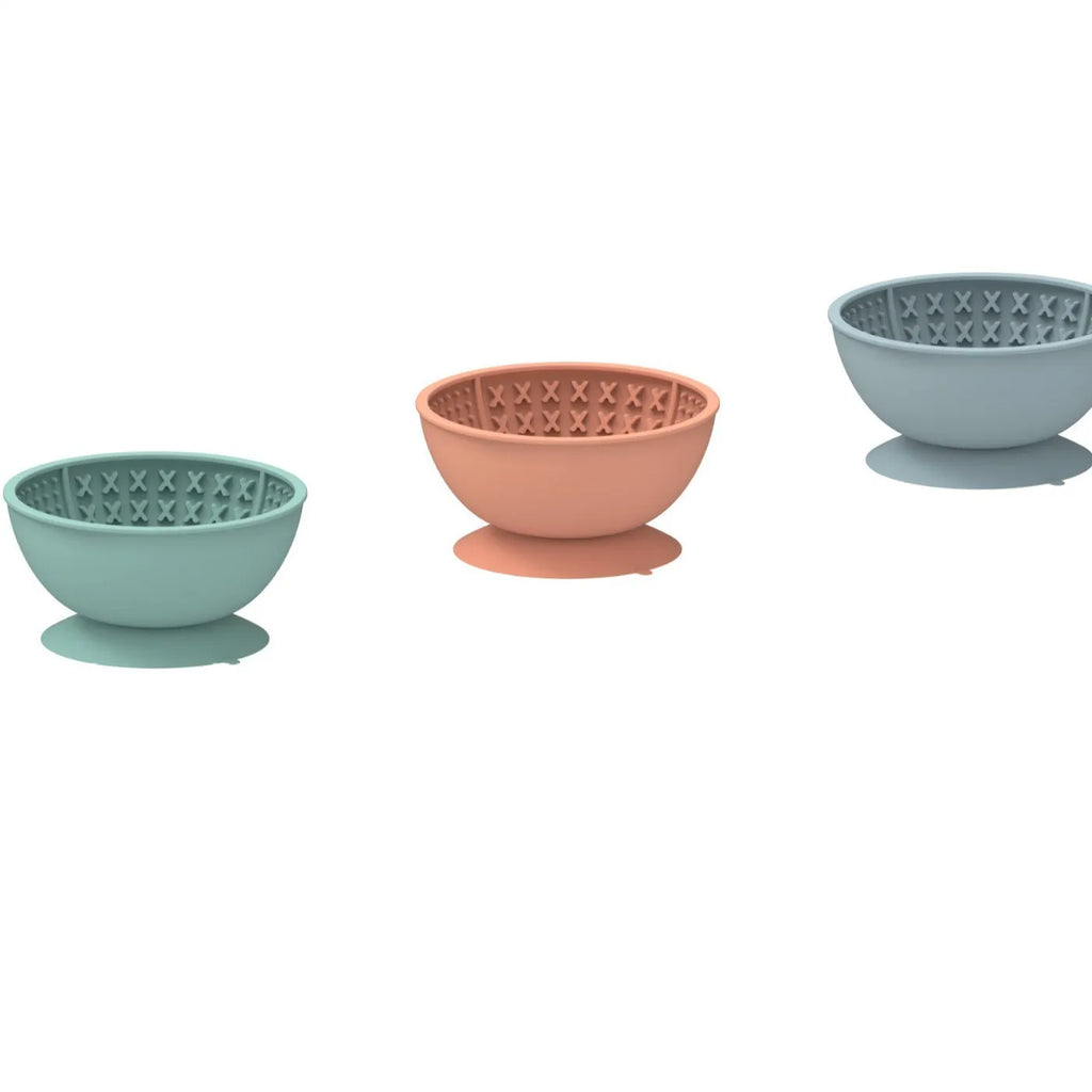 Cyan silicone pet bowl with textured licking mat pattern and suction cup base