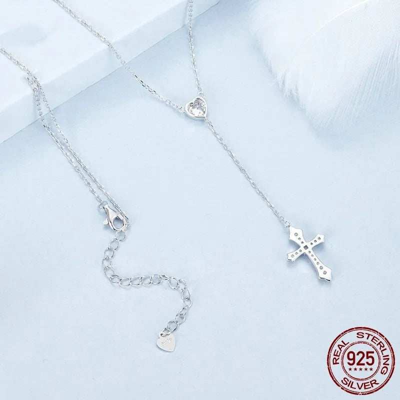 Simple silver cross necklace with V-neck and O-ring chain in colour BSN384.
