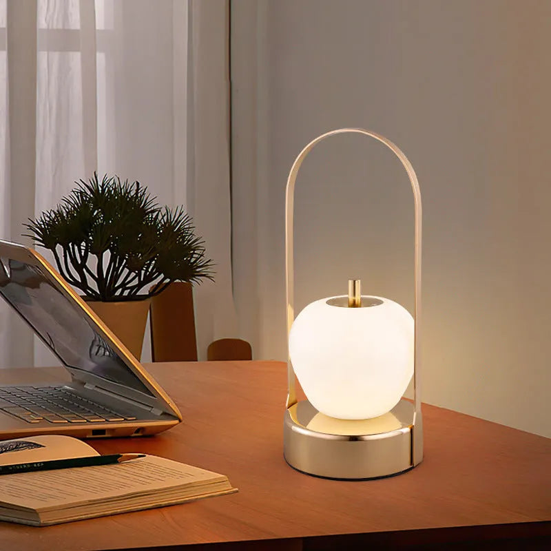 Rechargeable bedside table lamp with metal holder, golden, portable for camping and emergency use, USB charging