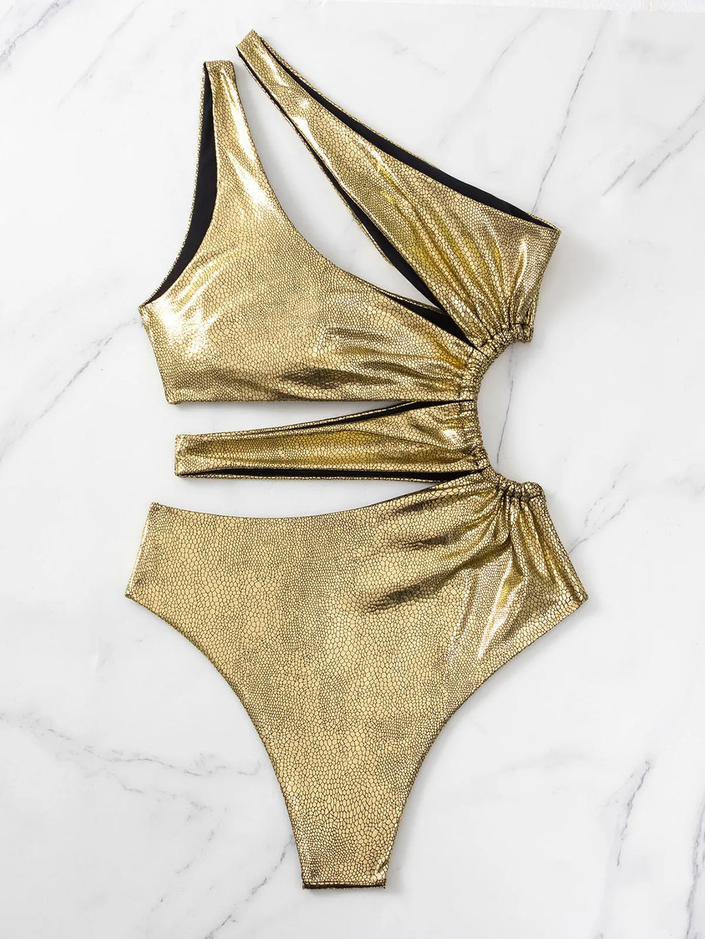 Women's gold backless one-piece swimsuit with spandex material on mannequin