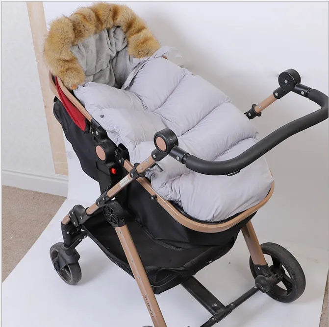Baby stroller sleeping bag in polyester fiber with down cotton filling, 46x95x8cm, available in ten colours.