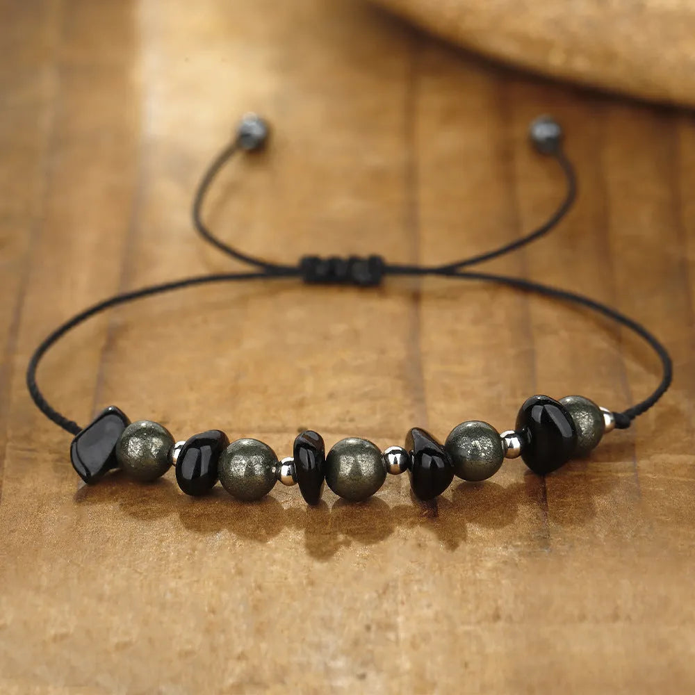 Black garnet geometric stone bracelet with moon charm on wrist