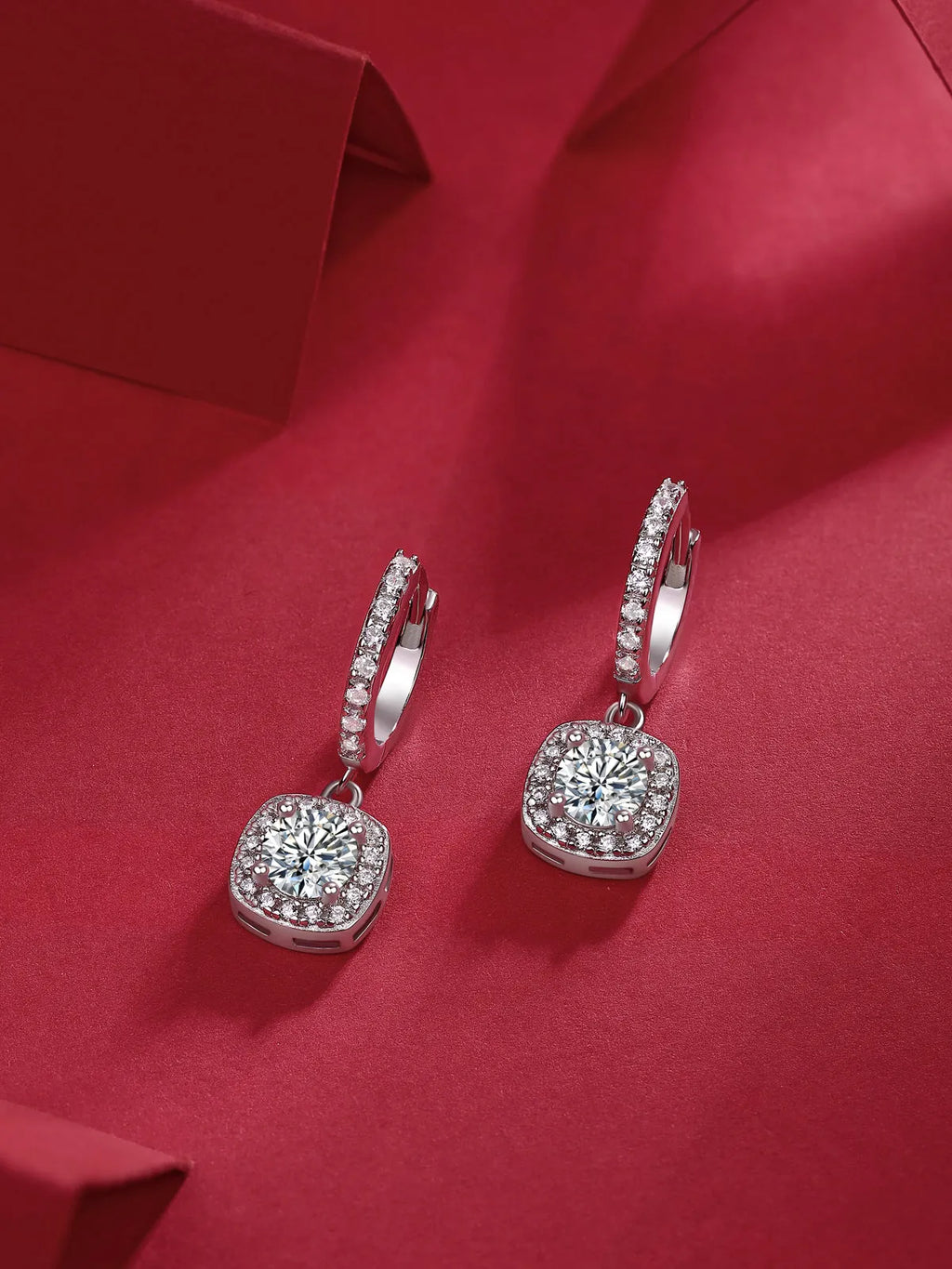 Pair of 0.5-carat total moissanite stud earrings in S925 silver with platinum plating, shown with gift box and GRA certificate