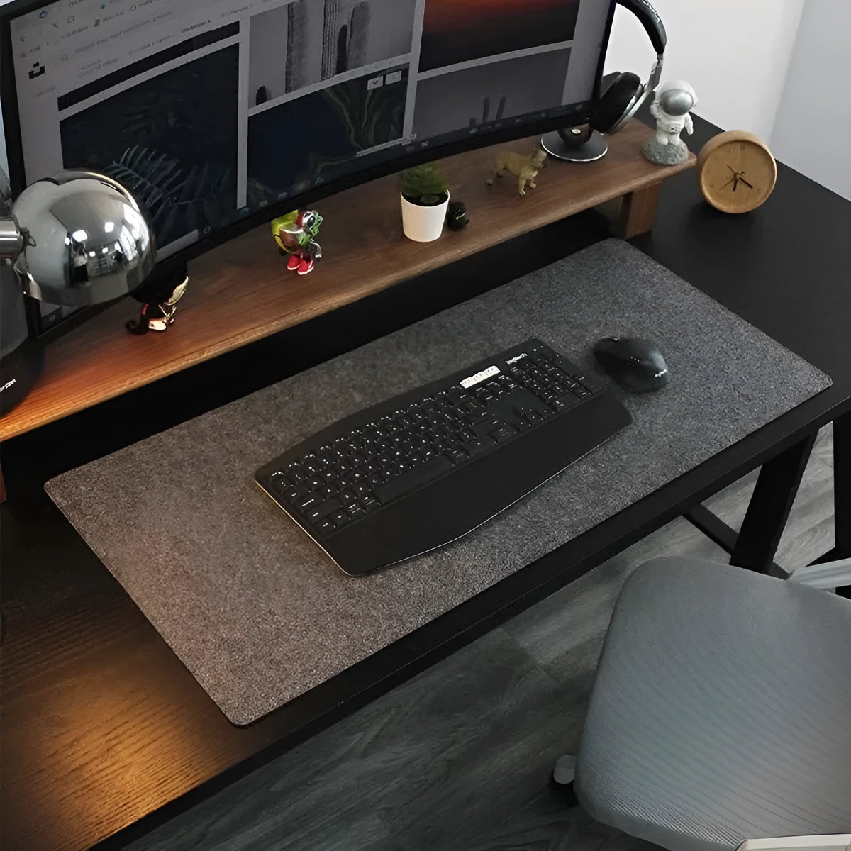 Extra large felt mouse pad in brown, black, grey, or light grey with non-slip backing and machined edges.