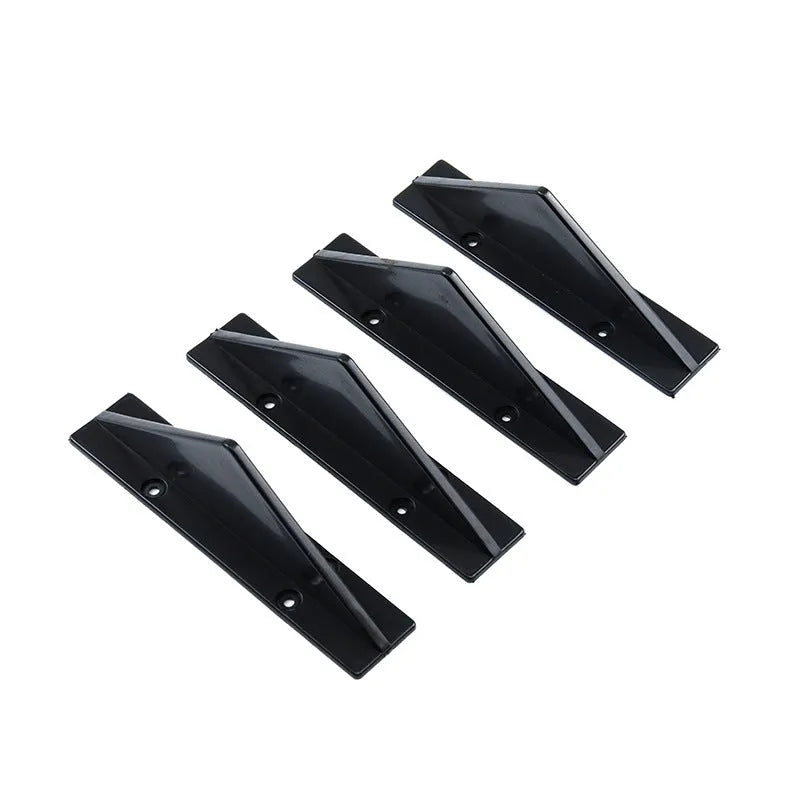 Black triangular car rear spoiler on a white background, shown with screws and adhesive tape.