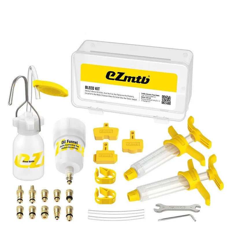 EZmtb bicycle hydraulic disc brake bleed kit with syringes, bottles, adapters, and tools laid out.