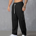 Men's navy blue corduroy cargo trousers with a drawstring waist and straight wide-leg cut on a hanger.
