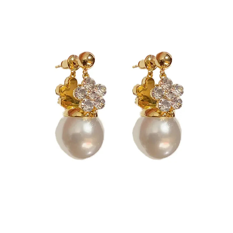 Female Korean style double-sided flower pearl earrings in gold plated copper with clip-on design
