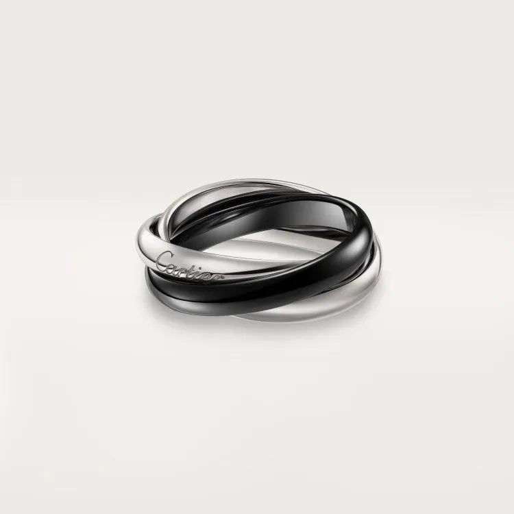 Solid silver couple rings on a hand, showing full diamond pave and plain band options in gold rose, silver, and black finishes.