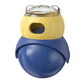 Morandi yellow and blue plastic owl-shaped cat puzzle feeder toy on a wooden floor.