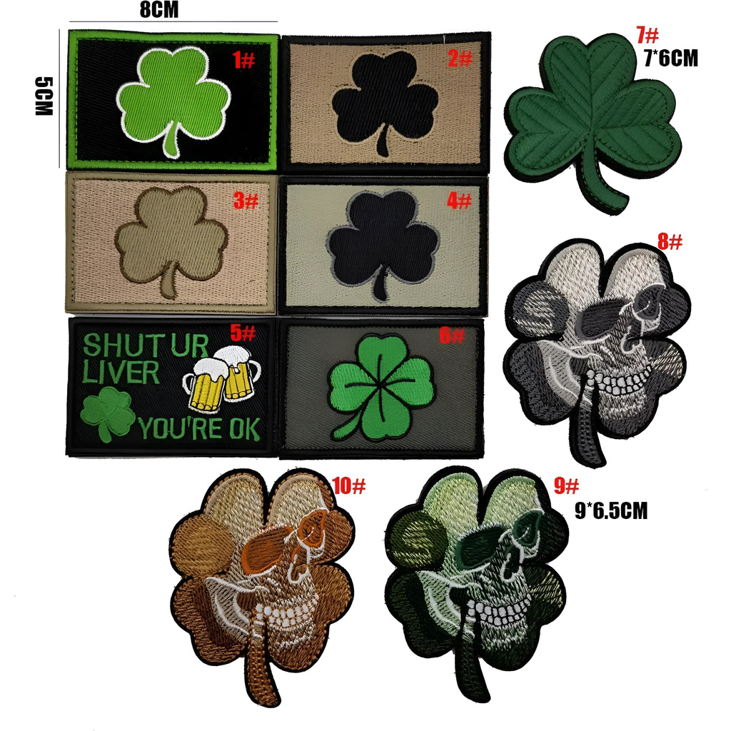 Outdoor embroidered fabric badge with Velcro backing on a green clover design.