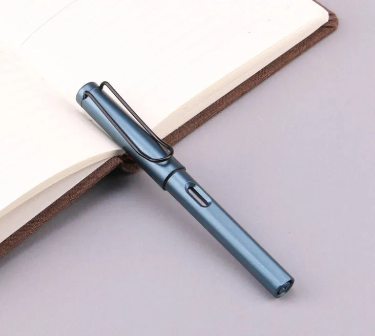 Black and blue frosted ink bag fountain pen with 0.5mm and 0.38mm stainless steel nib options on a notebook.