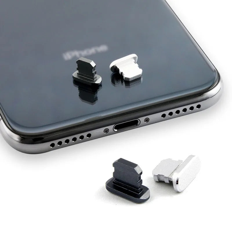Aluminium alloy iPhone charging port dust plug in various colours on a white background.