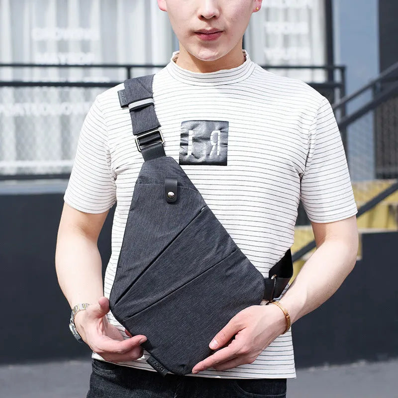 Canvas chest bag for men in black Oxford cloth with zipper closure, worn across the chest for anti-theft security