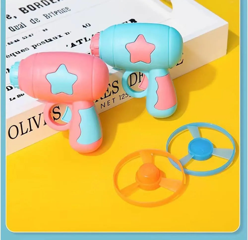 Blue plastic cat toy gun with spinning frisbee launcher for indoor play