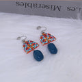Retro yellow blue contrast acrylic earrings with irregular geometric shapes and electroplated finish