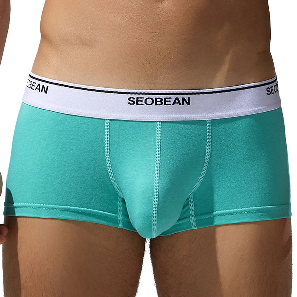 Men's solid colour cotton low-waist boxer shorts on a white background