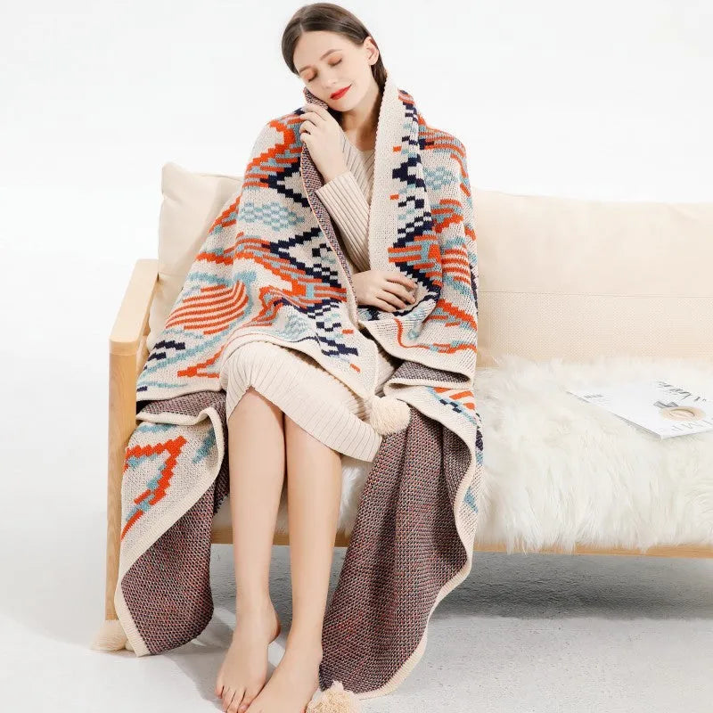 Bohemian-style acrylic knit sofa blanket with tassels in a geometric pattern
