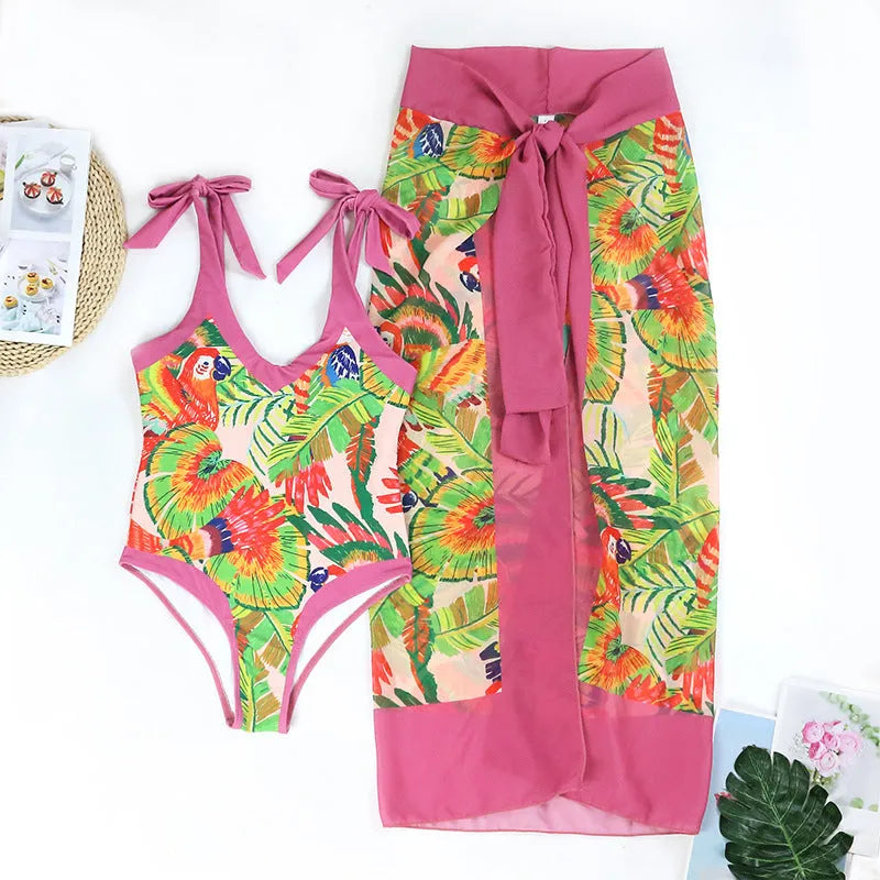 Retro floral print one-piece swimsuit with V-neck, covered belly, and attached thin skirt in pink