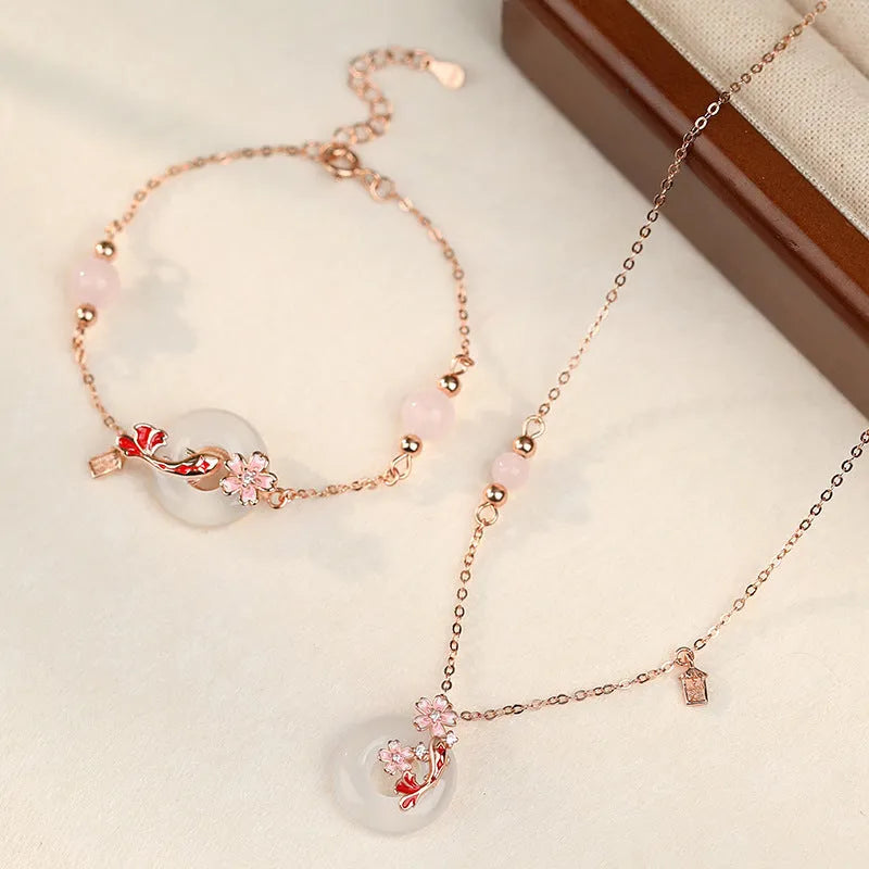 S925 sterling silver bracelet with Chinese flower design and white chalcedony crystal accents featuring koi fish motif