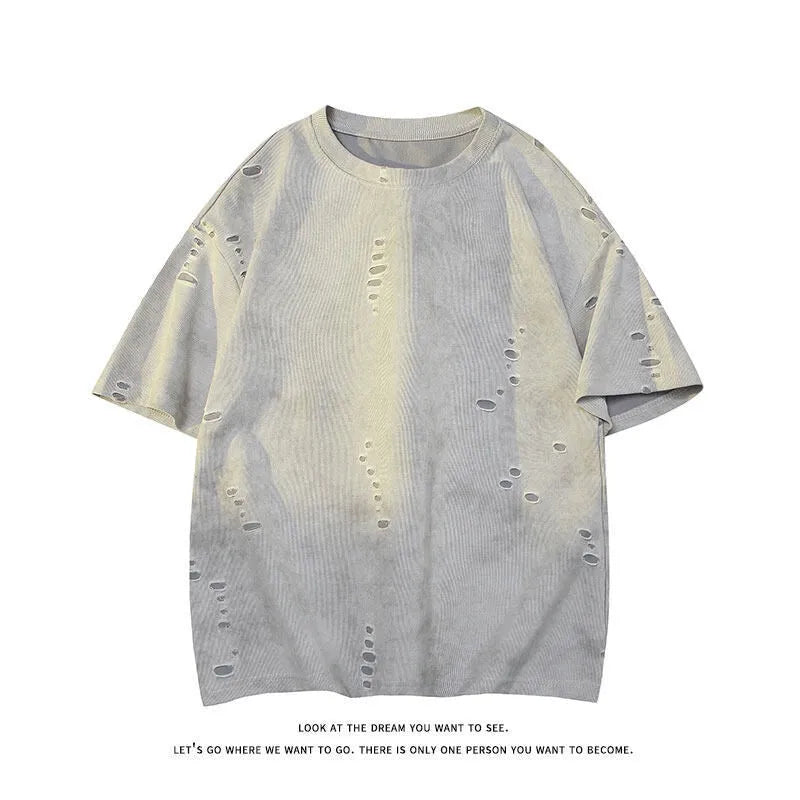 Men's blue loose fit cotton blend T-shirt with ripped detail on short sleeve, laid flat.