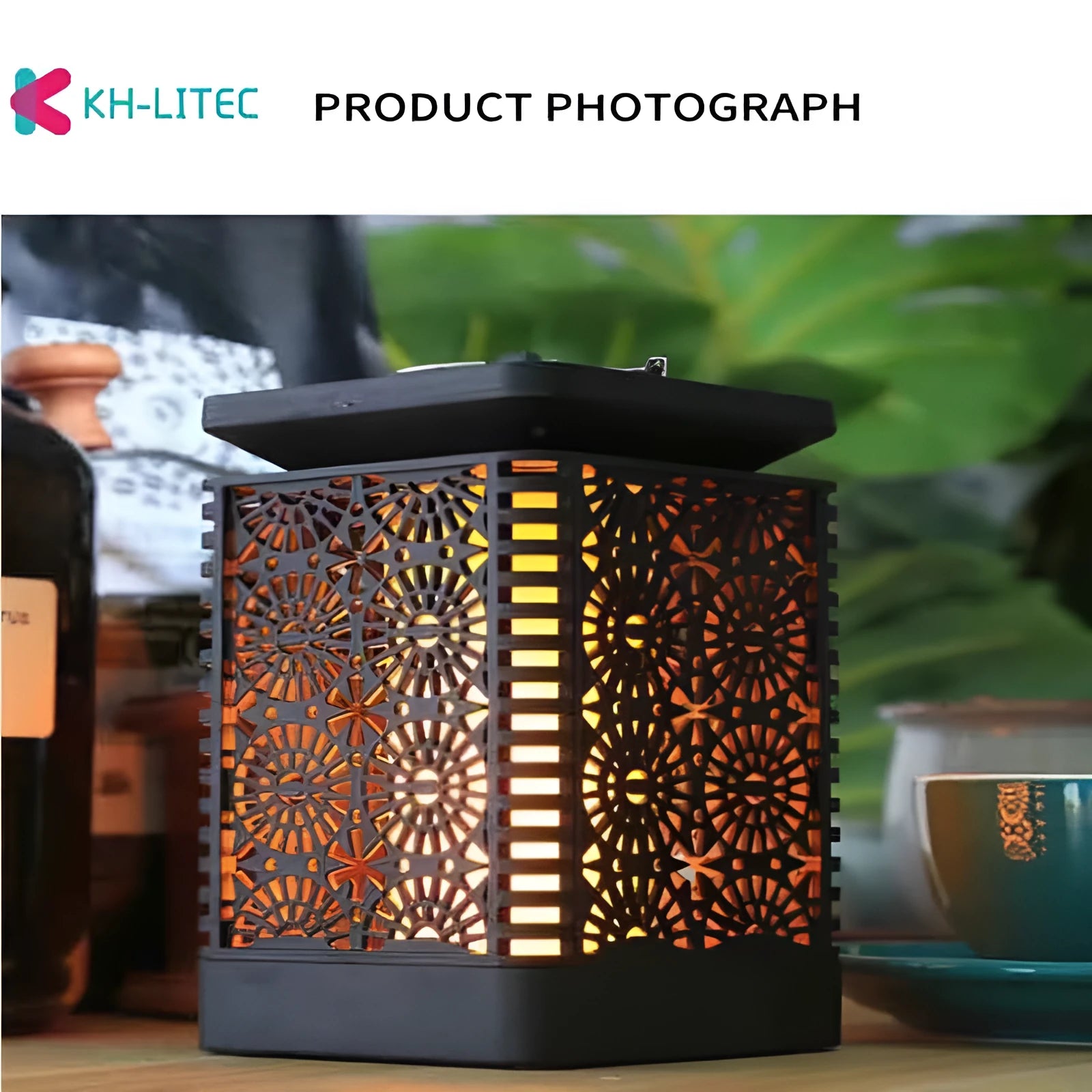 Set of four black solar-powered garden lanterns with flickering LED flame effect.