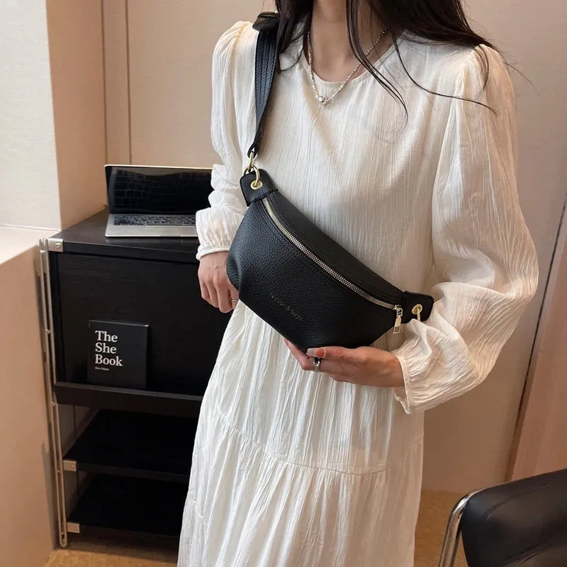 PU medium soft waist bag with single shoulder strap and zippered compartment, black colour, splicing detail