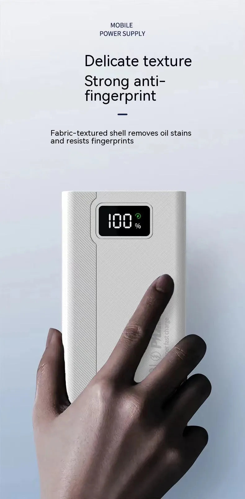 Large black and white power bank showing size comparison next to a mobile phone.