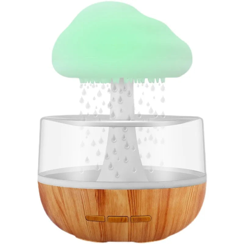White portable USB humidifier with night light and essential oil diffuser on a wooden surface.