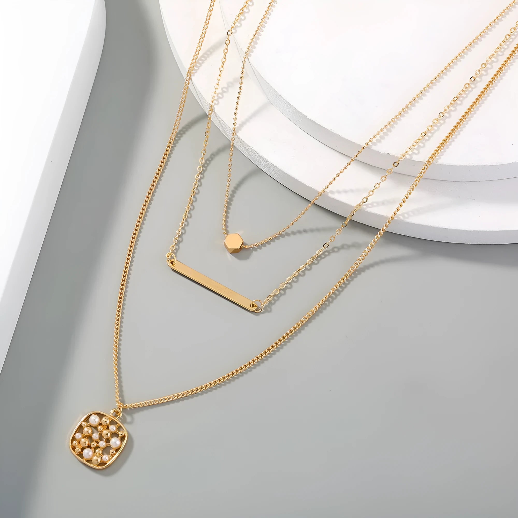 Multi-layer gold necklace with geometric pineapple pendant on adjustable chain, electroplated finish, zinc alloy