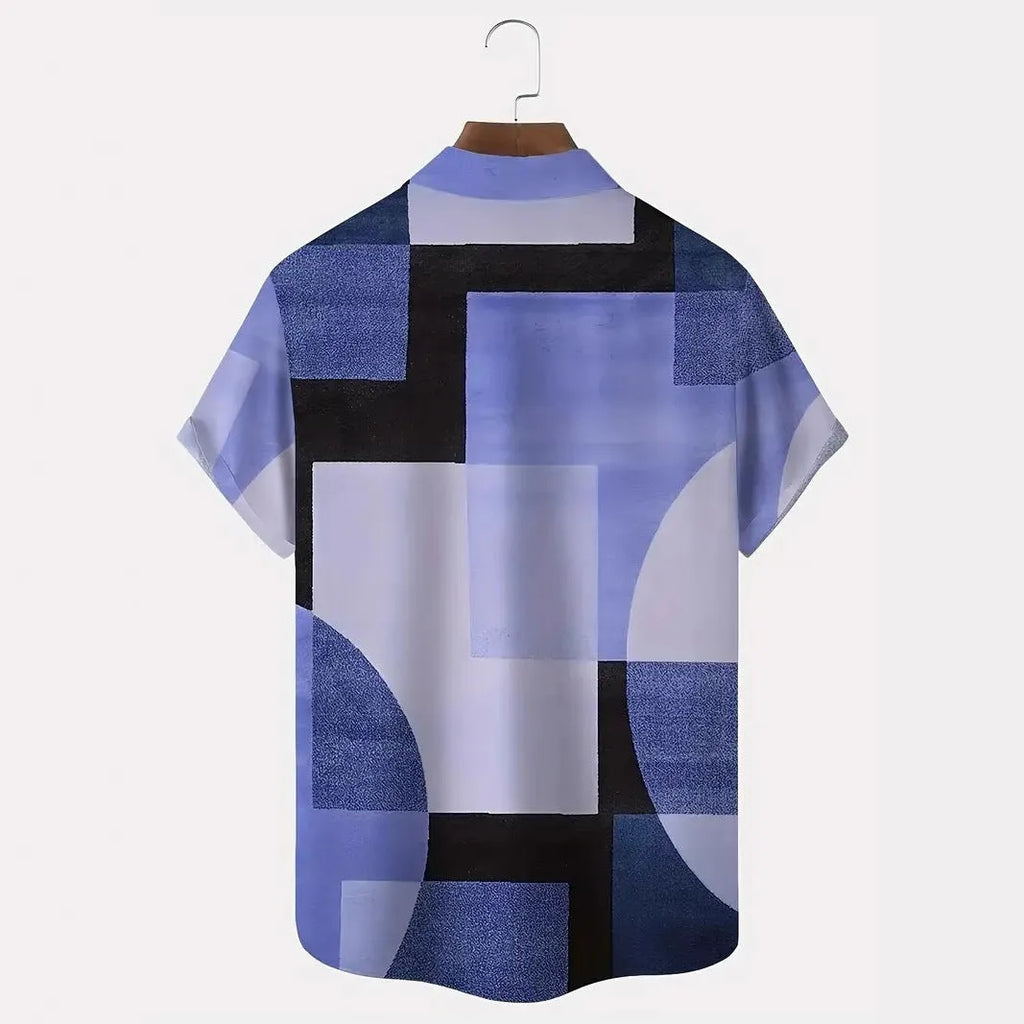 Man wearing a loose-fit short sleeve cardigan shirt with a blue and white 3D printed geometric square pattern.