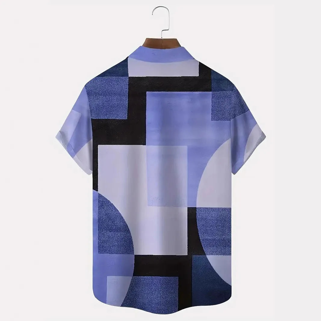 Man wearing a loose-fit short sleeve cardigan shirt with a blue and white 3D printed geometric square pattern.
