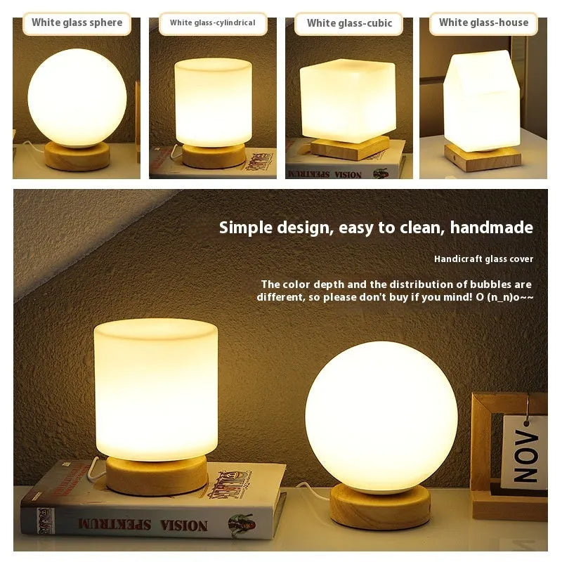 Nordic style solid wood USB table lamp in a cube shape with touch dimming on a wooden desk.