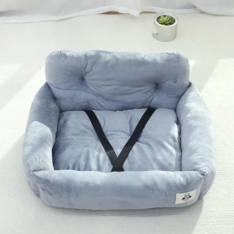 Grey and blue plaid cloth dog beds shown in two sizes for car travel.