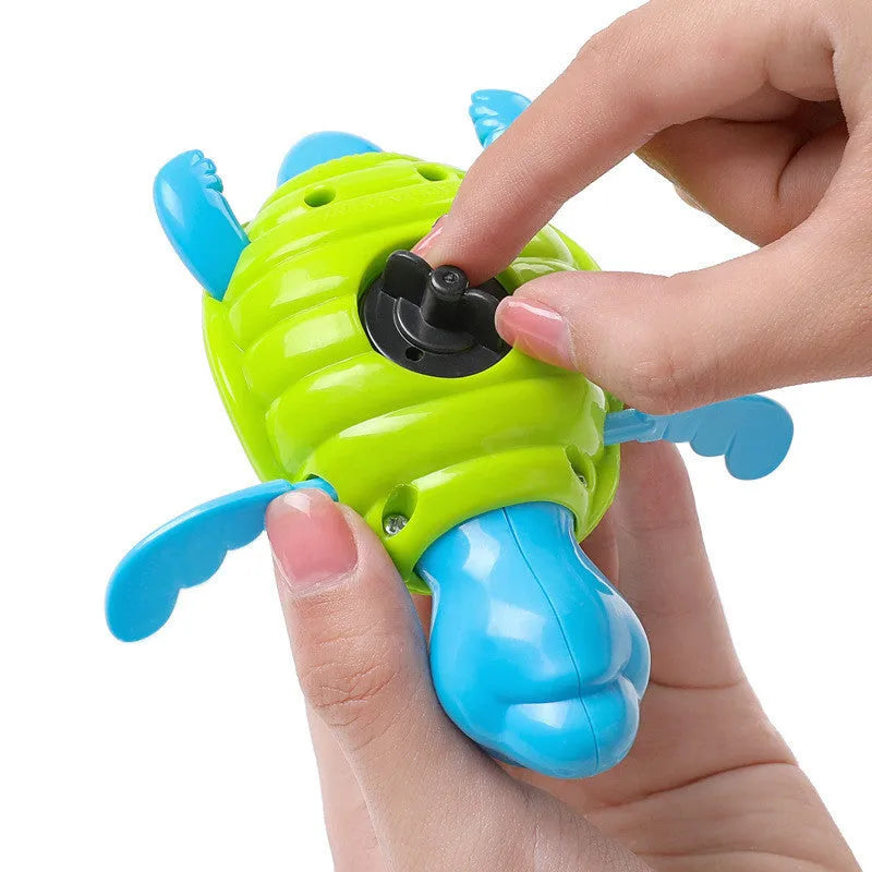 Plastic baby tortoise bathroom toy floating in water, random colour, approximately 12 cm long