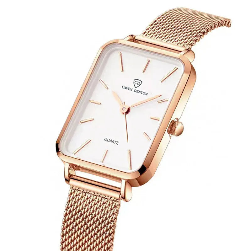 Rose gold women's quartz watch with woven steel strap on wrist, showing alloy case.