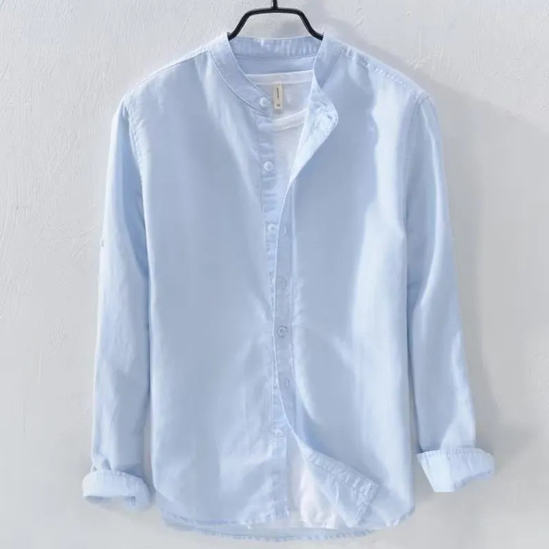 Man wearing a loose fit light blue linen cotton long sleeve casual shirt