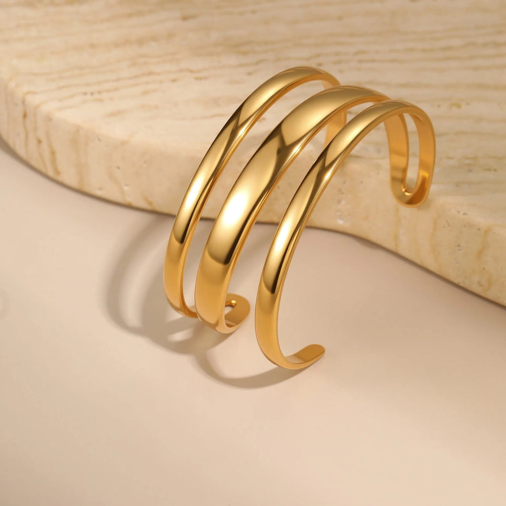Women's stainless steel bracelet with geometric design and simple opening mechanism in gold electroplated finish