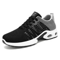Men's low-top Flyknit mesh sneakers in black and blue colour, showcasing the lace-up design and round toe.