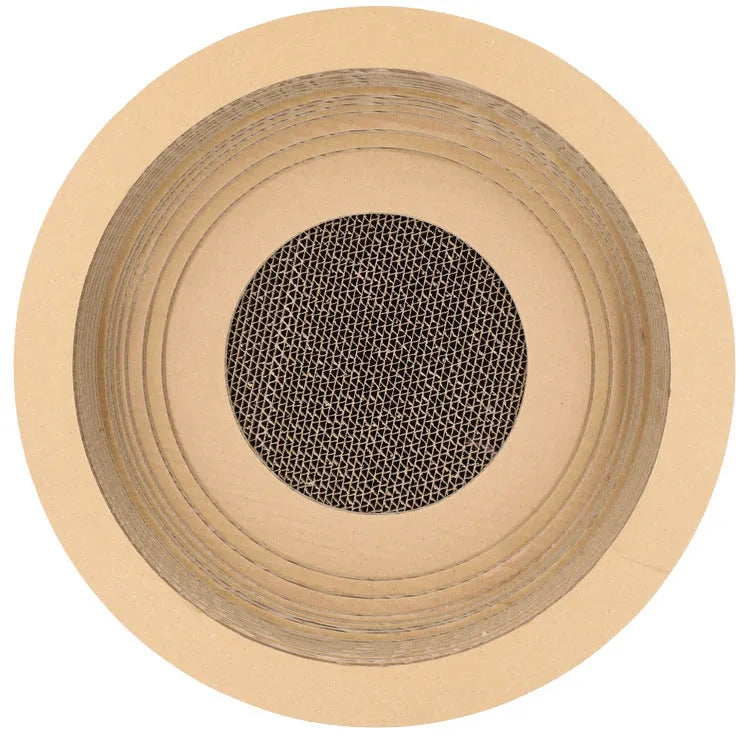 Brown compressed paper cat scratch board with 40cm diameter and 11cm height on a wooden floor