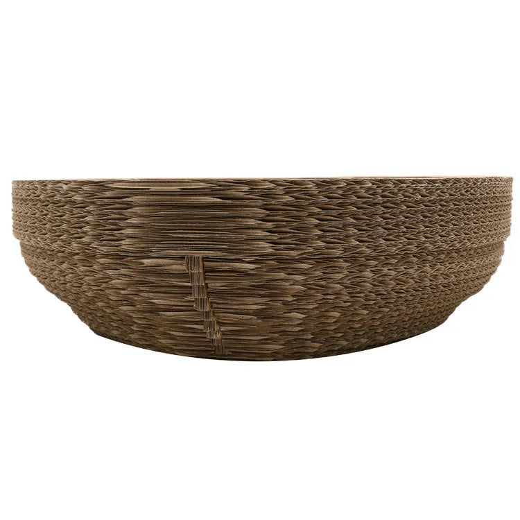 Brown compressed paper cat scratch board with 40cm diameter and 11cm height on a wooden floor