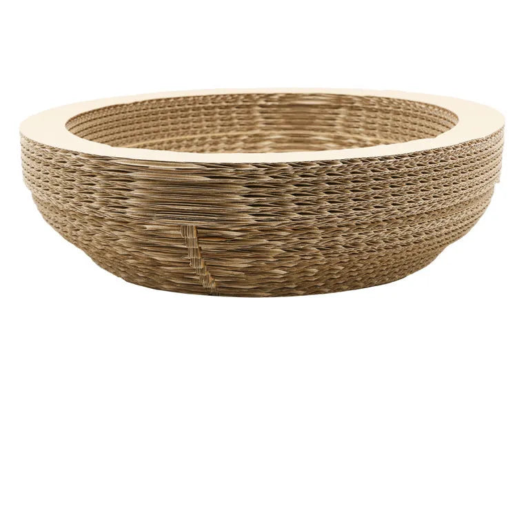 Brown compressed paper cat scratch board with 40cm diameter and 11cm height on a wooden floor