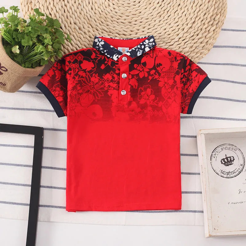 A solid colour short sleeve polo shirt for a young boy, made from soft cotton fabric.