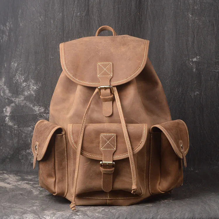 Men's leather drawstring backpack in first layer cowhide, retro style, 30cm x 15cm x 40cm, with curved shoulder strap and soft handle.