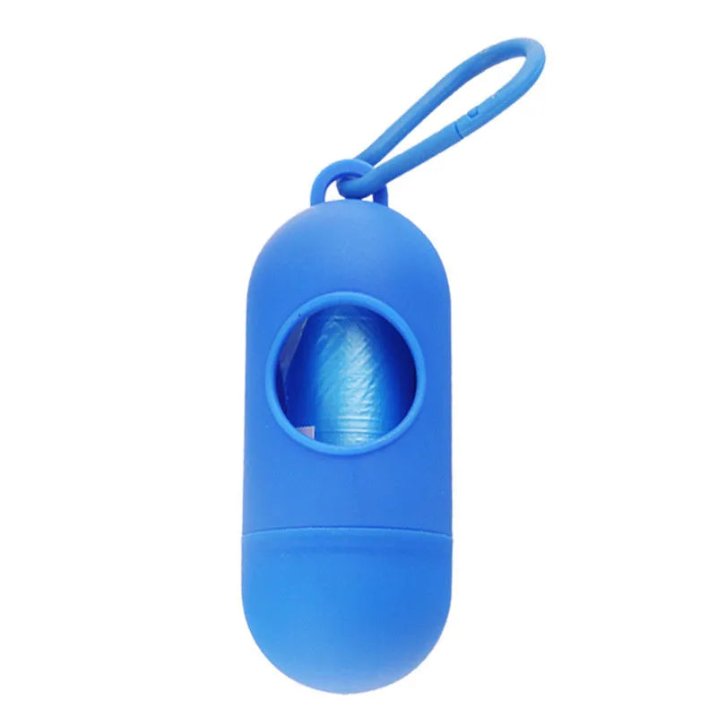 Black dog waste bag holder with Velcro strap and metal hook, showing bag dispenser slot.