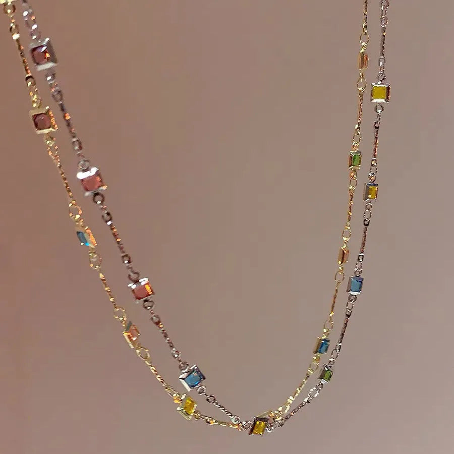 Square colour geometric alloy clavicle chain necklace with artificial crystal detail in gold tone.